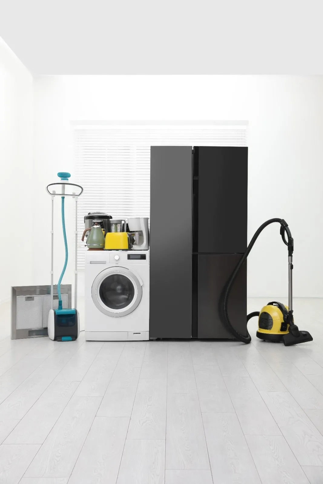 Refrigerator, washer and vacuum in a laundry room